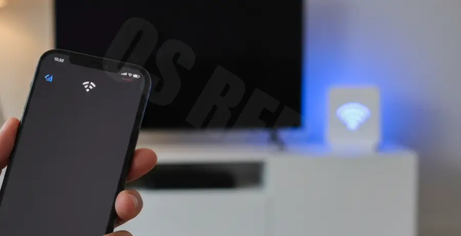 iPhone 16 Pro showing unstable WiFi connection icon on screen.